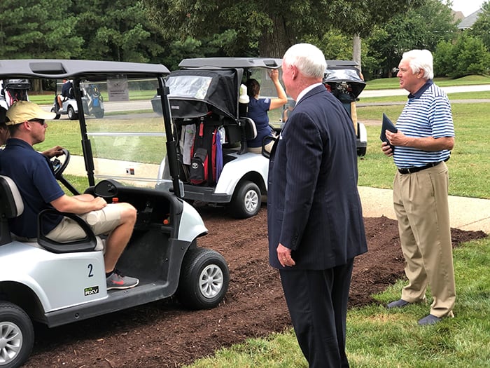 Bob and Morgan at the golf tournament.