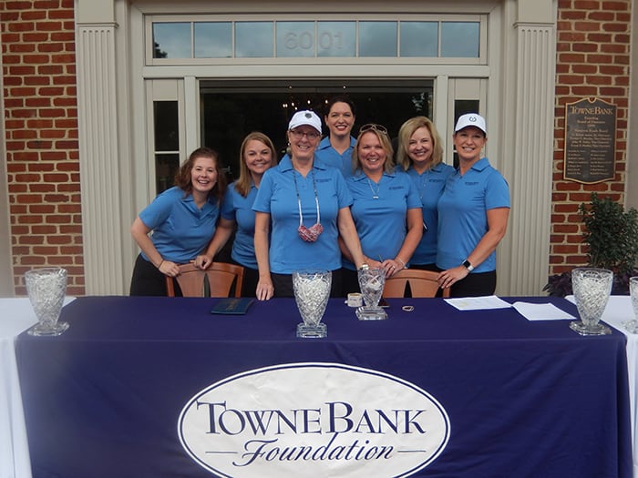 Golf tournament registration volunteers.