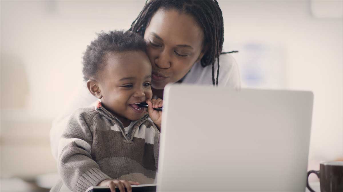 mother and son with laptop
