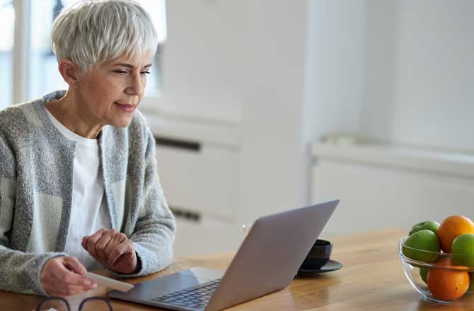 woman looking at computer