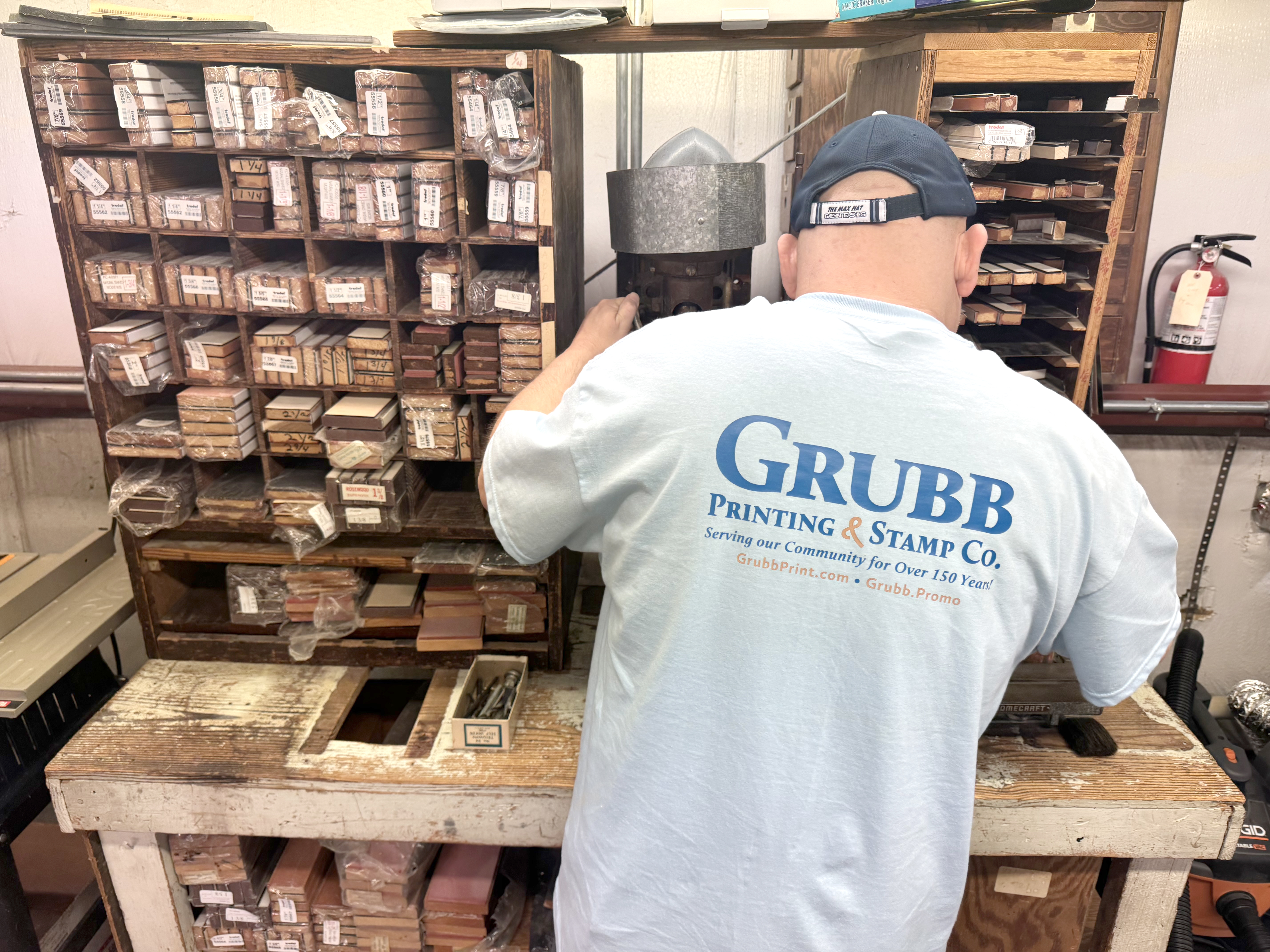 Image of Man with his back towards the camera in a Grubb Printing shirt