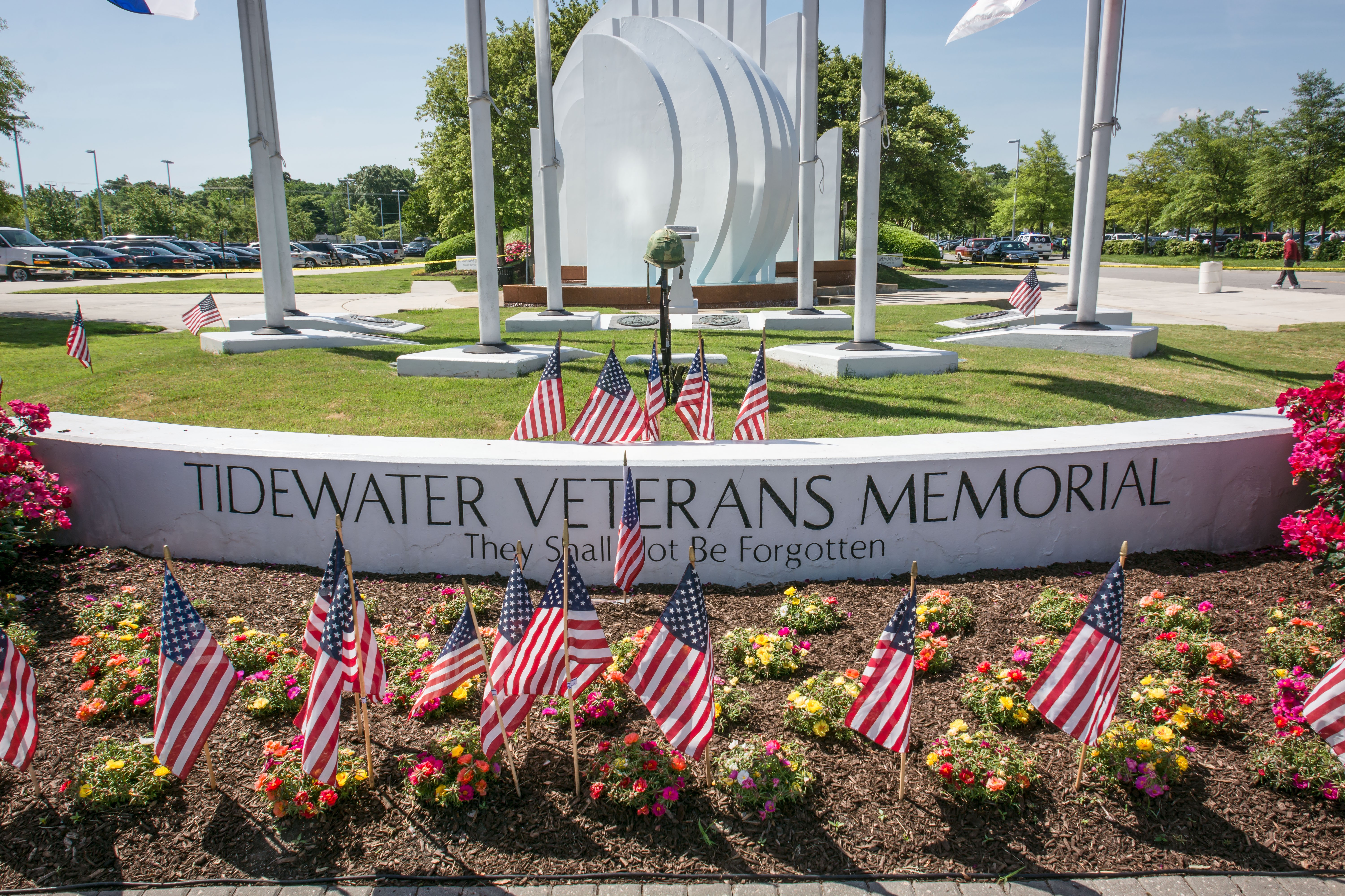 image of tidewater veternas memorial with american flags in front