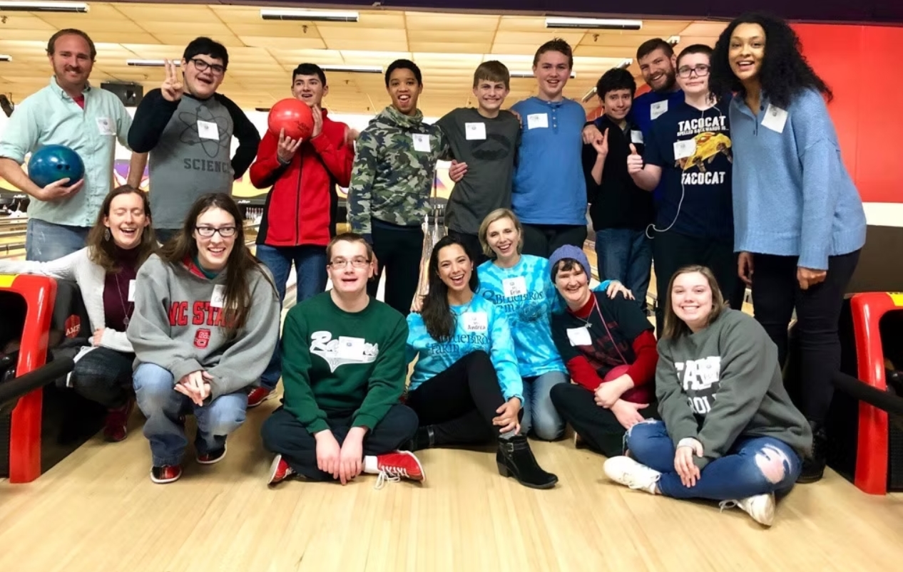 group photo at a bowling alley