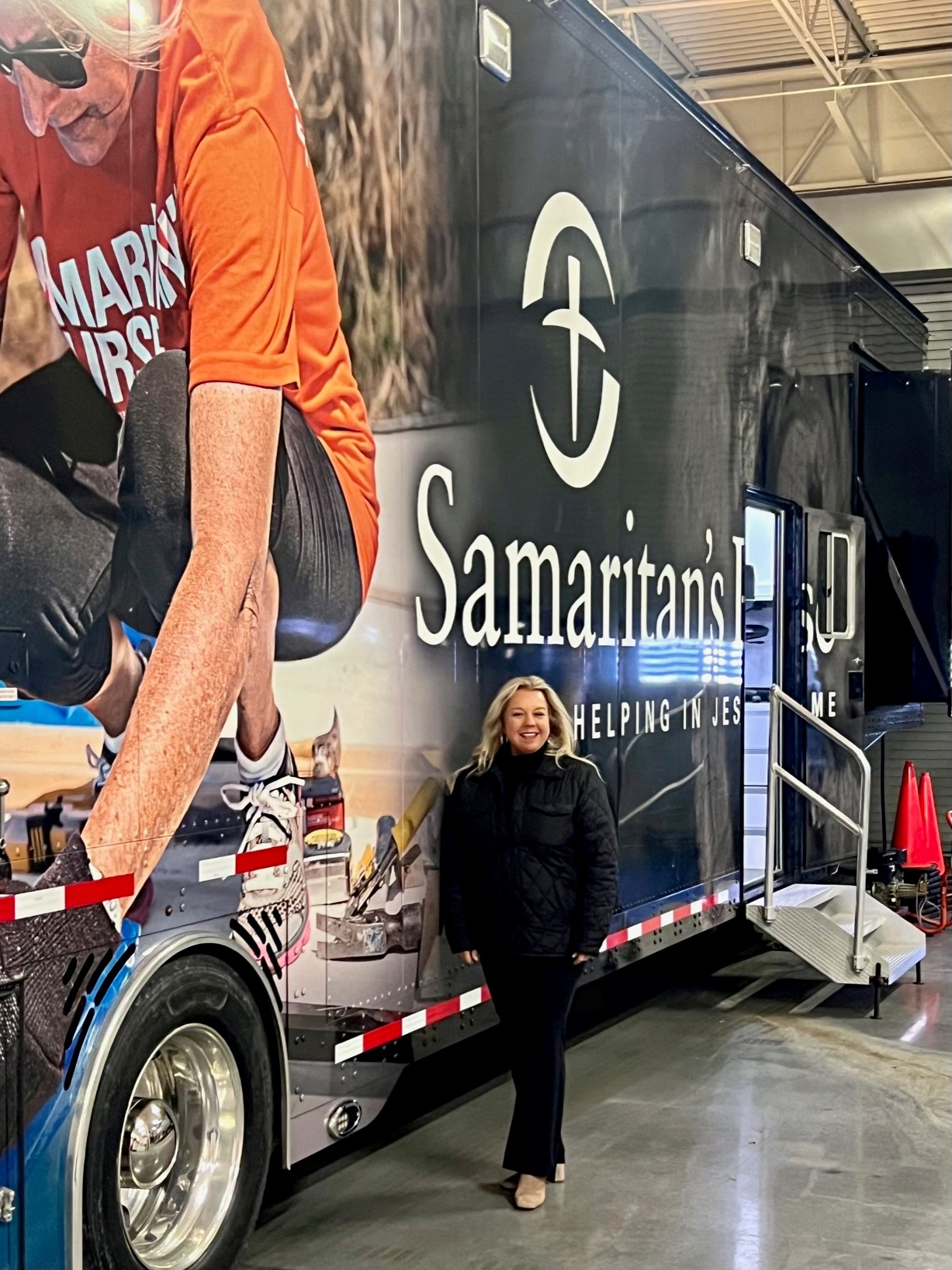 melissa spain standing in front of a bus