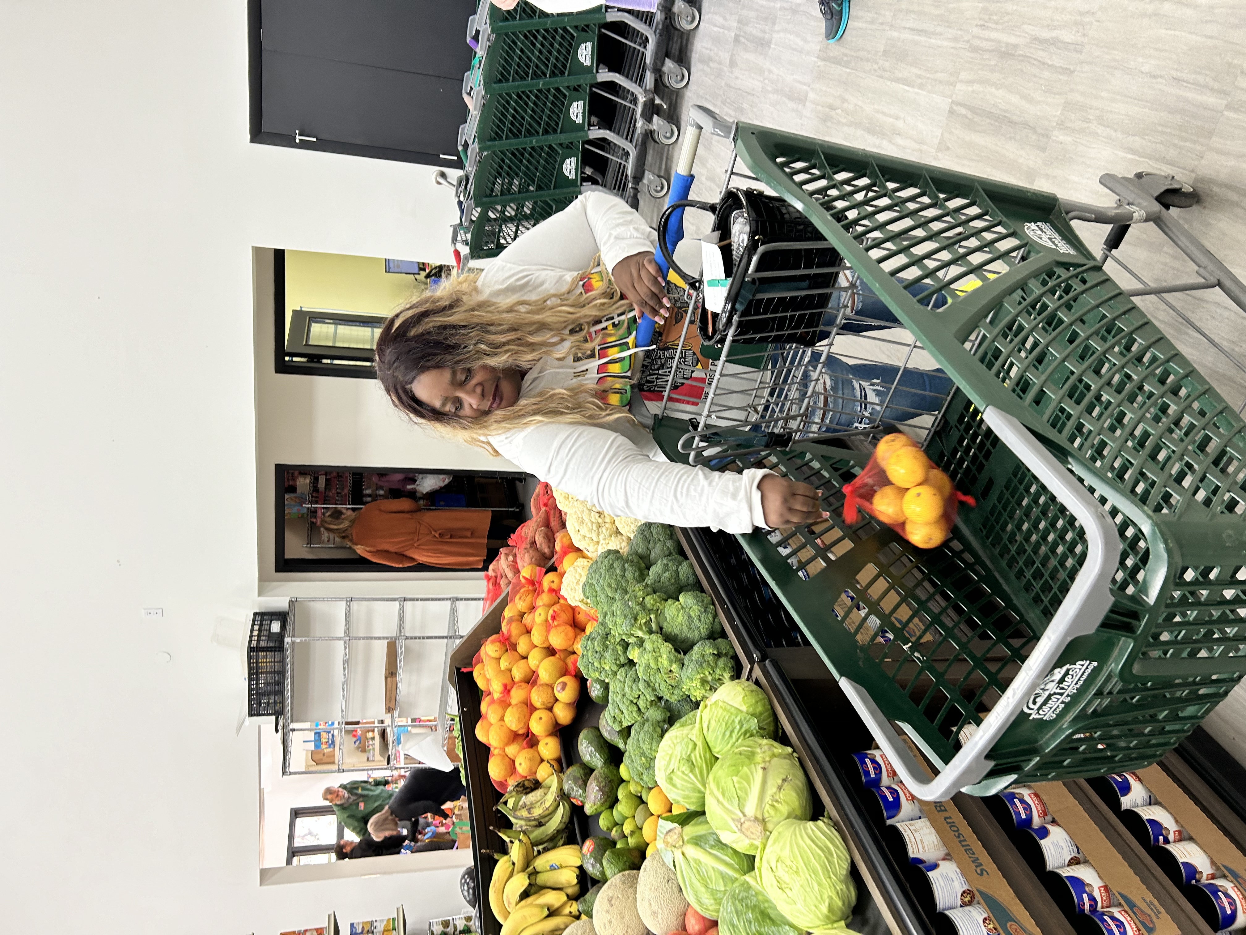 woman shopping putting food into cart