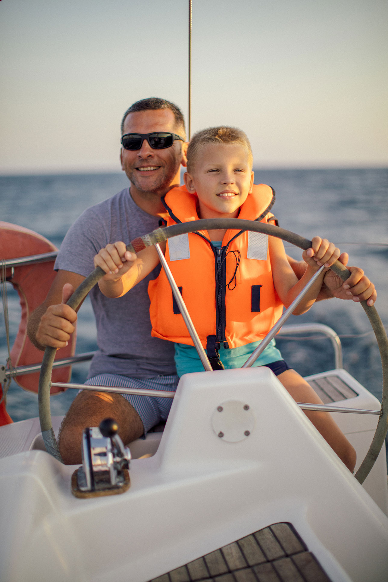 dad and son on boat