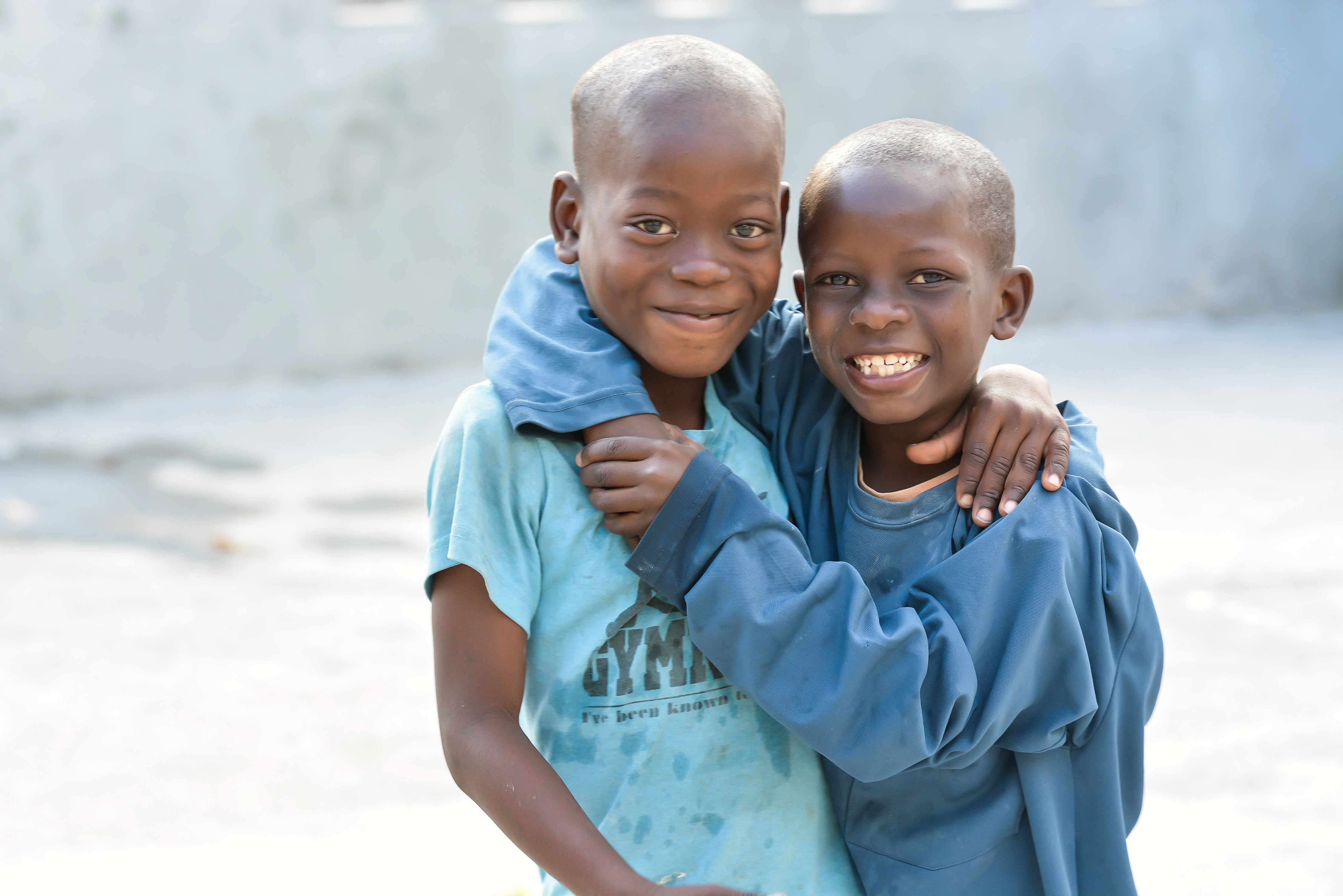 two boys smile for the camera