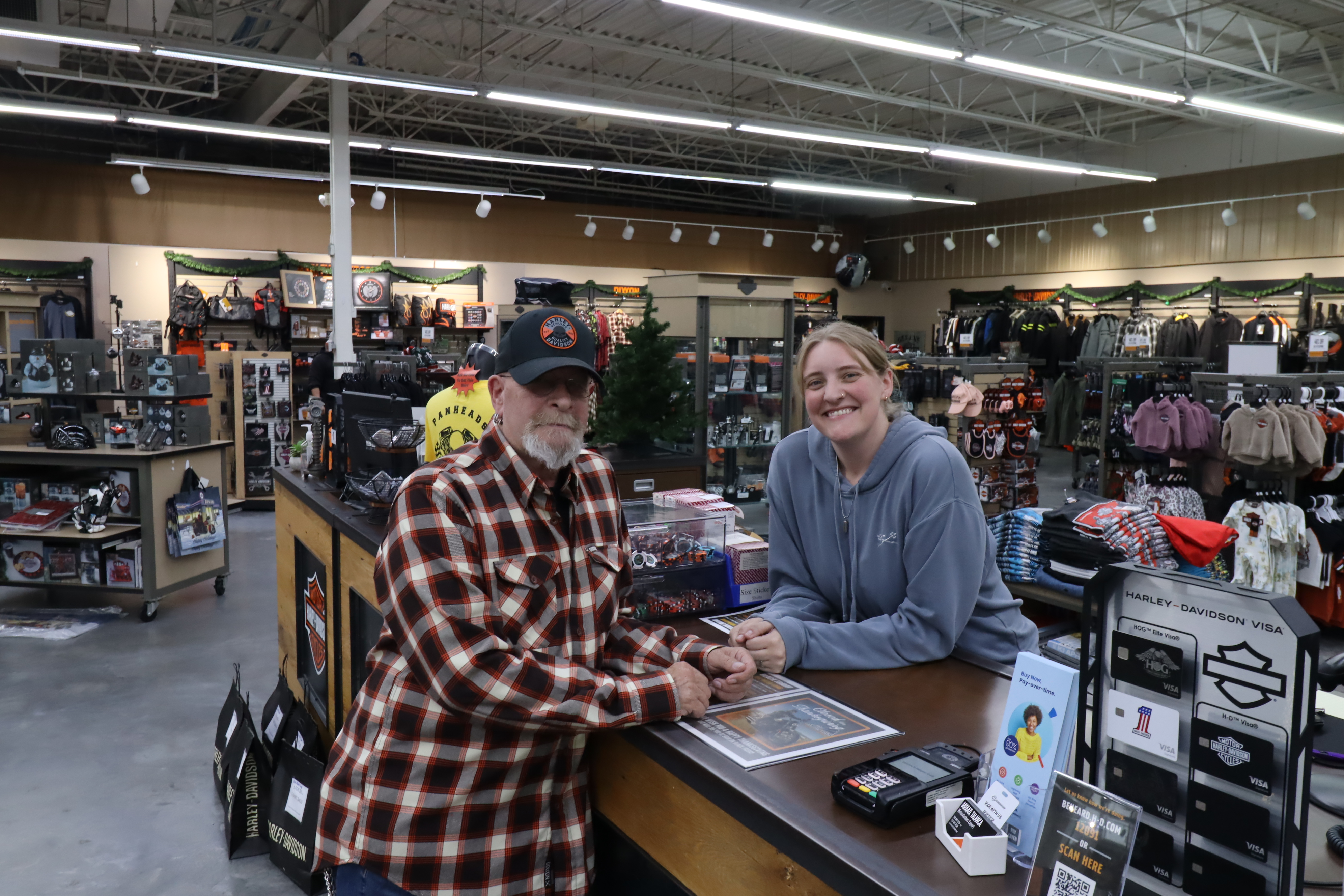 Image of two people standing over a counter