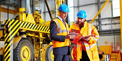 two construction men discussing