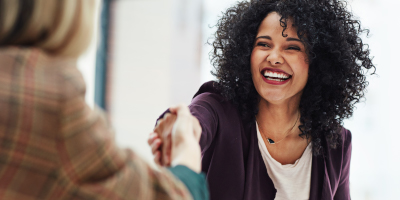 woman smiling in a meeting