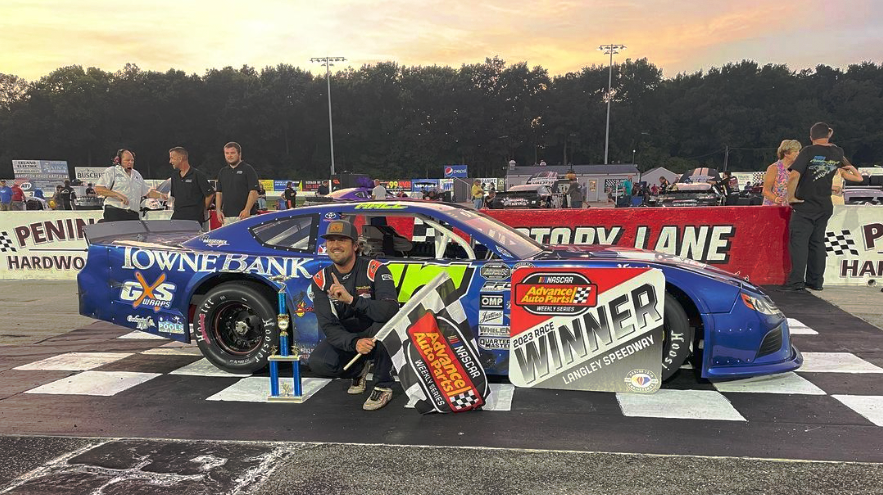 Connor Hall in front of racecar