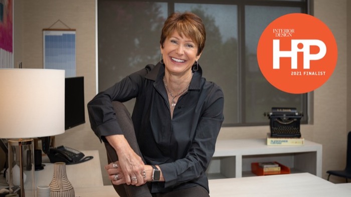 Photo of Susan Pilato in office with HIP logo superimposed.