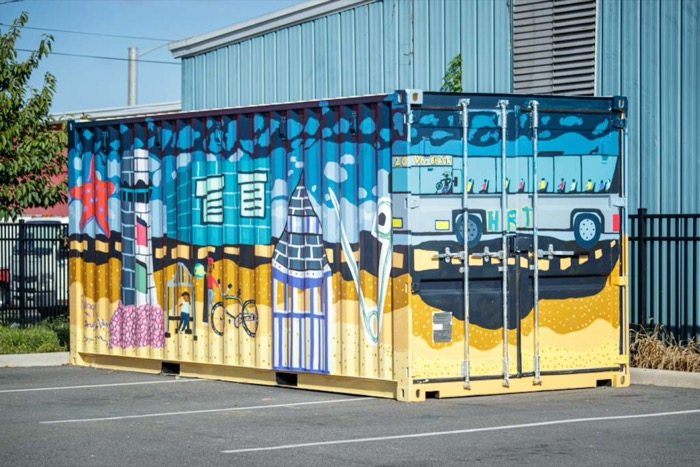 Colorful mural painted on shipping container.