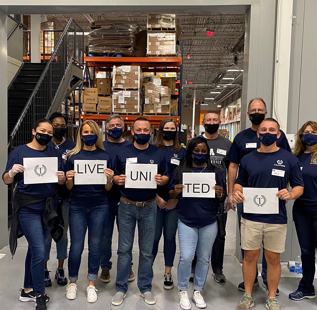 Group of volunteers at warehouse.