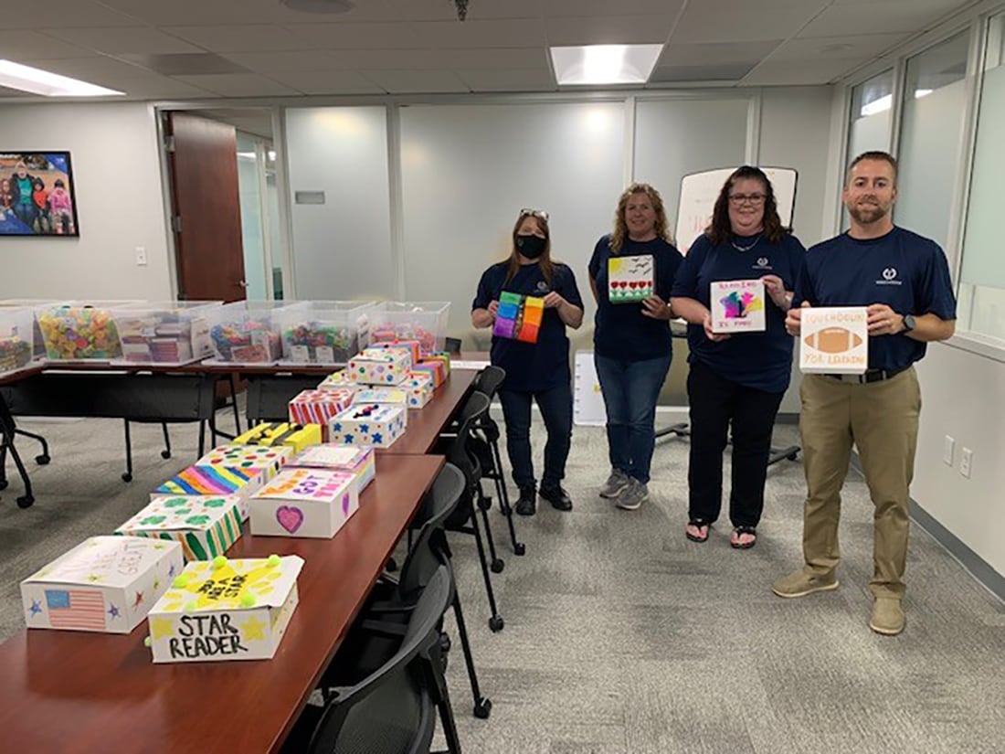 TowneBank volunteers working to assemble and decorate literacy kits.